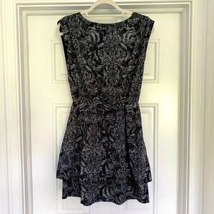 Black and white patterned flowy dress.